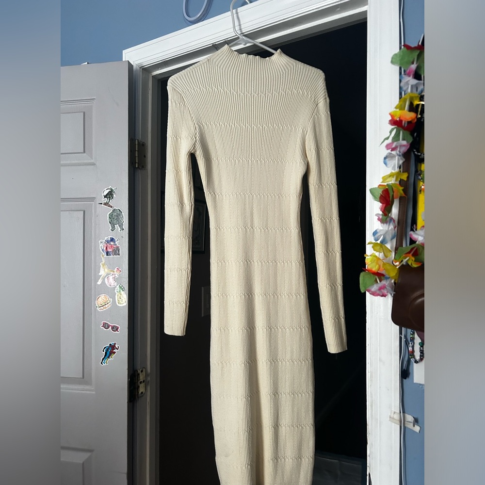 Sweater dress never worn size L, cream color . Bought from “Cider”